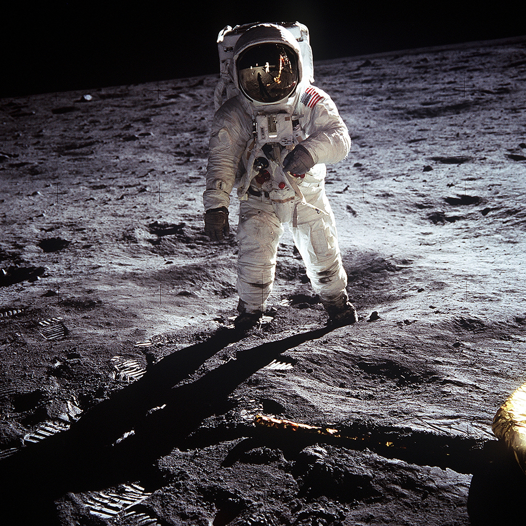 Buzz Aldrin stands on the moon