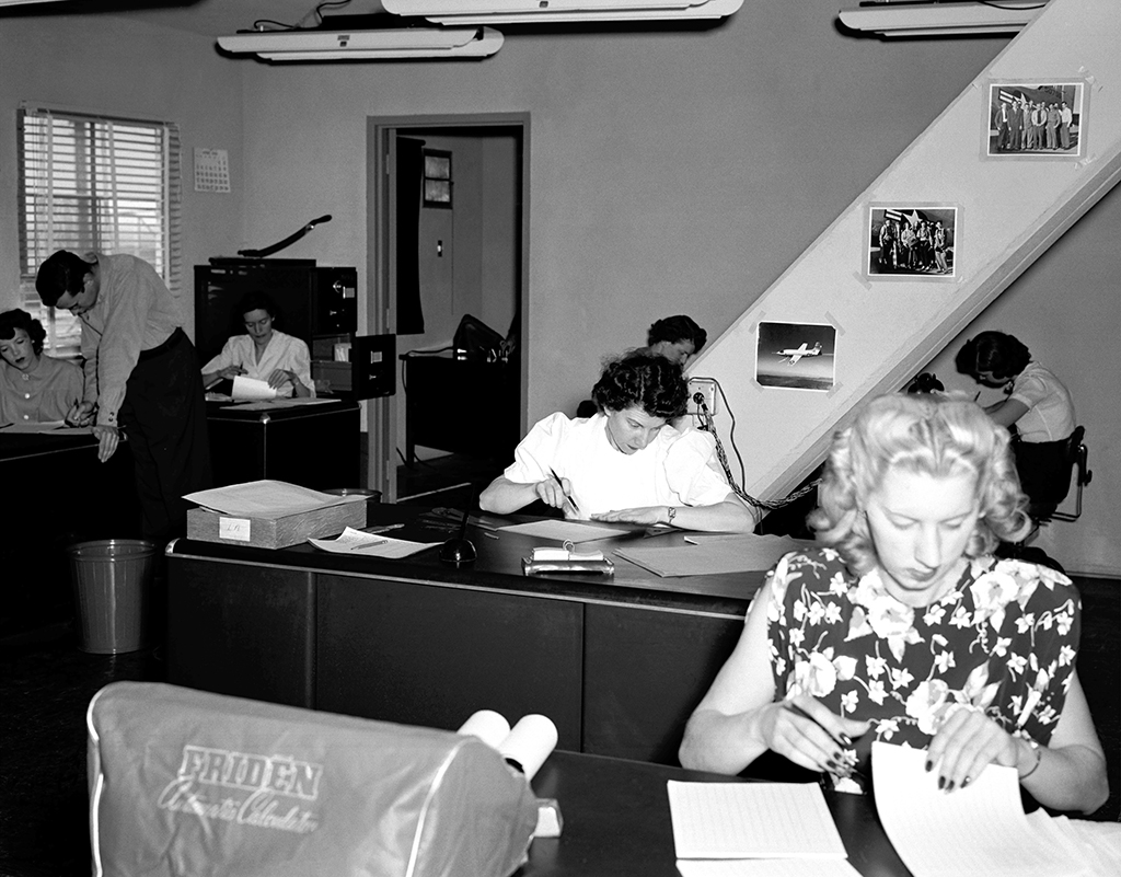 Group of women working in an office doing computations for NASA