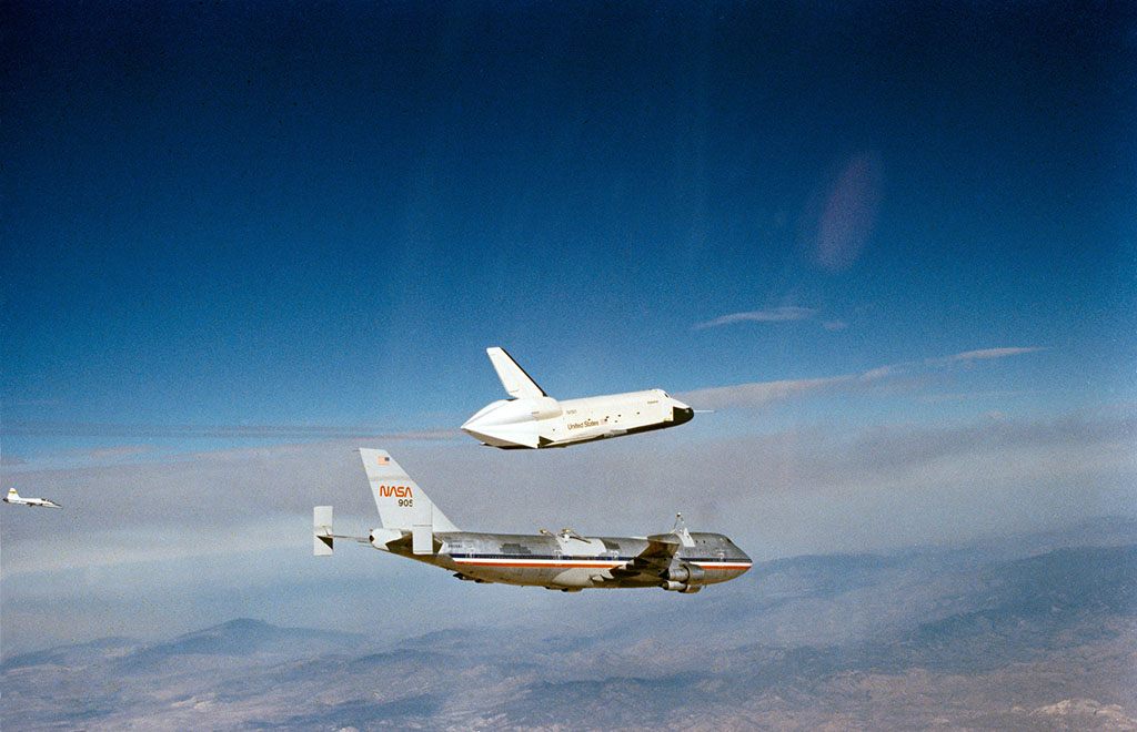 piggyback testing the space shuttle flying above a plane over the mountains