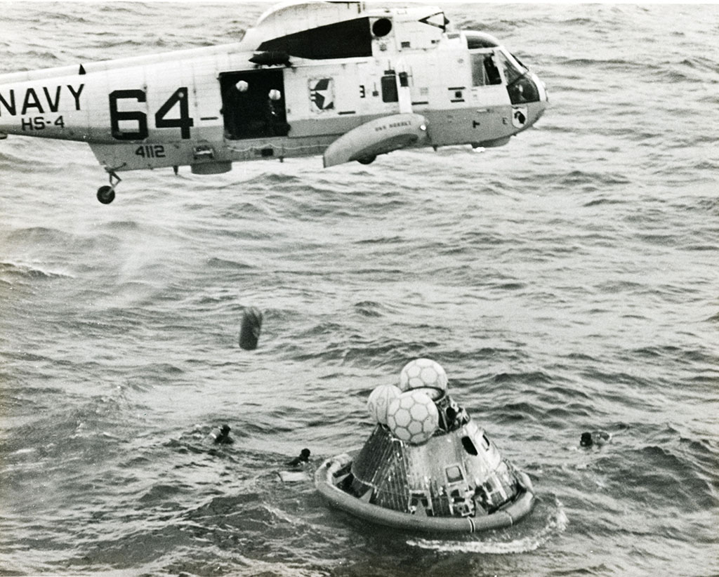 Helicopter rescues the Apollo 11 capsule and crew from the ocean