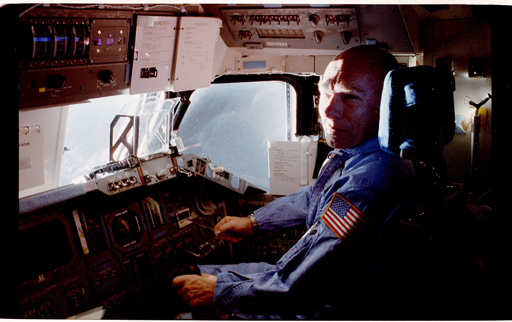 Dr. Thornton sitting in a cockpit